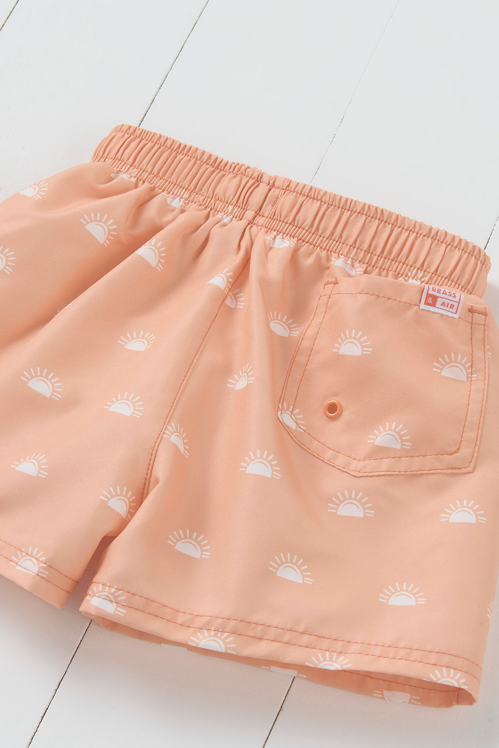 Grass and Air peach sun print kids swim shorts