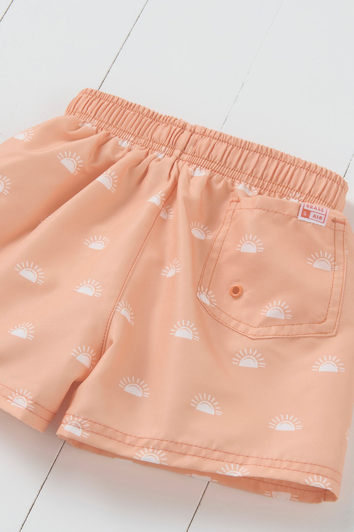 Grass and Air peach sun print kids swim shorts
